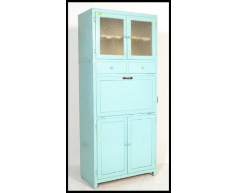 A vintage mid 20th Century upright kitchen unit, an arrangement of glass and panel doors, fall front cupboard with attached e