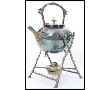 A 19th century Victorian silver plated spirit burner picnic kettle by Fenton Brothers. Raised on bark effect stand with bark 