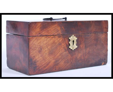 A 19th century Georgian mahogany tea caddy, with a scrolled swing handle, inlaid mother of pearl to the lid, a brass scutcheo