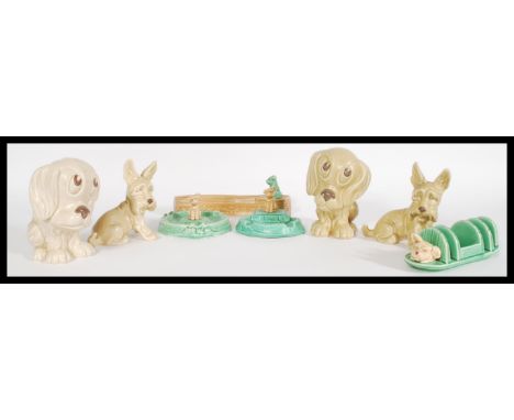 A mixed collection of vintage 20th century SylvaC ceramic figurines to include a dog and pond form ash tray, a dog and fence 