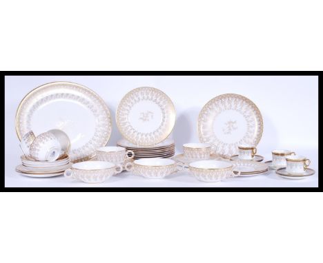 A vintage 20th Century Royal Worcester bone China part service, ornately decorated in gilt overlay, consisting of various siz