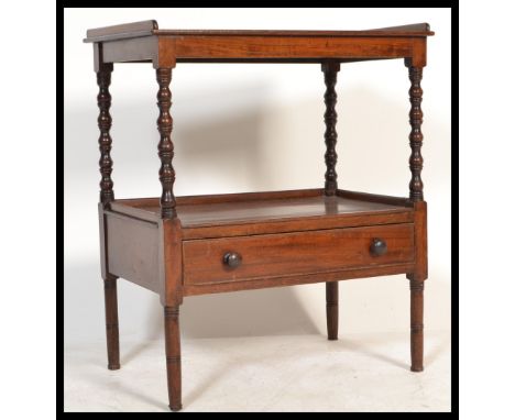A 19th Century mahogany two tier buffet, both tiers gallery framed with single drawer to lower tier, bobbin turned supports o