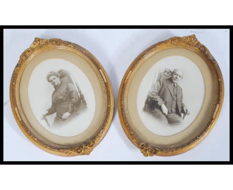 A pair of early 20th century portrait marital photographs of an Edwardian couple in gilt oval frames having an acanthus leaf 