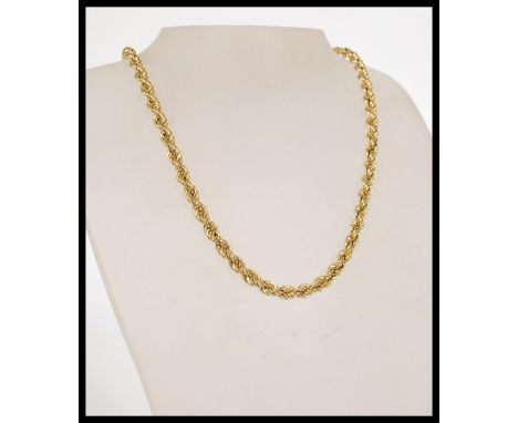A hallmarked 9ct gold rope chain necklace with a round spring clasp. The necklace is approximately 18 inches in length and we