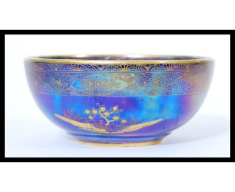 A Carlton Ware lustre ware bowl in the Persian pattern with makers stamps to base. Measures 5.5 cm high and 12.5 cm diameter.