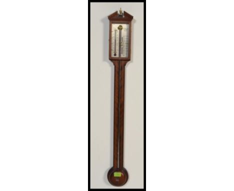 A vintage 20th century A Comitti and Son London mahogany inlaid stick barometer.&nbsp;