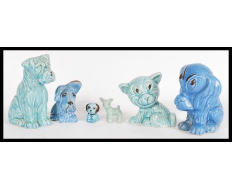 A collection on vintage 20th century SilvaC blue dog ceramics to include a blue Sad Sammy dog, blue terrier figurine, light b