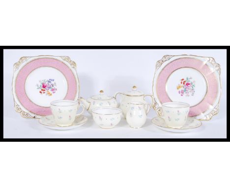 A 20th century Wedgwood s123 breakfast tea set in a chintz pattern comprising of two cups and saucers, a milk jug, teapot, su