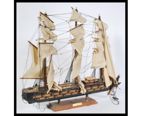 A vintage 20th century&nbsp; scratch built model of a three masted galleon with sails and rigging. Raised on stand.&nbsp;Meas