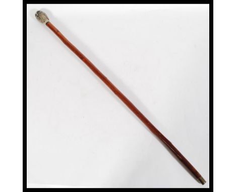 A 20th Century cane walking stick, surmounted with a resin top modeled as an owl, raised on tapering shaft and finished with 