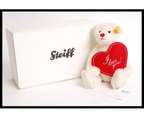 A 20th century Steiff teddy bear 000164 Fabian ' I Love You ' bear. White mohair, with glass eyes and ' I Love You ' heart to
