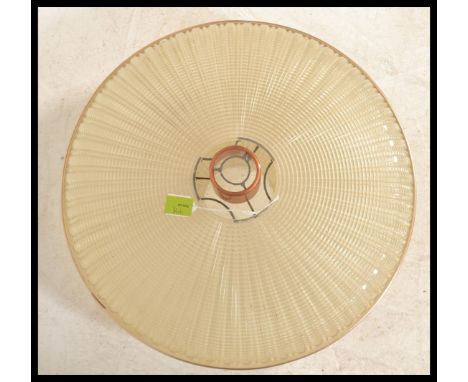 A pair of vintage retro ceiling lamps to include a 1960's style yellow rise and fall pendant lamp with a bulbous form with a 