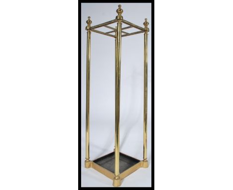 A Victorian 19th century brass tubular umbrella / stick stand. Quarter section with tray base having finial tops to the brass