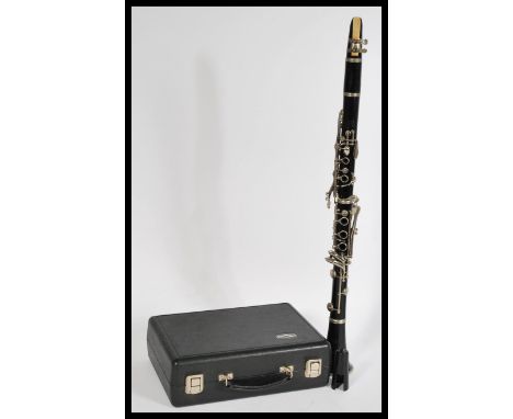 A cased&nbsp;Bundy Resonite The Selmer Company U.S.A five piece clarinet, housed within its original case.&nbsp;Measures: 10c