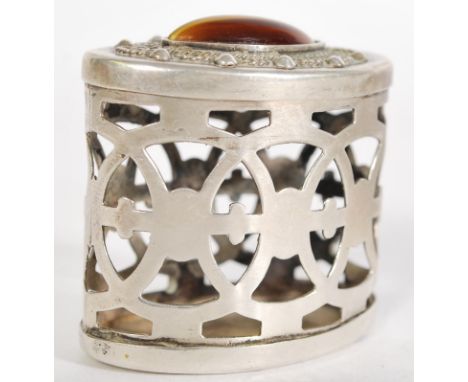 A continental silver fret pierced trinket pot having an inset tigers eye cabochon to lid. Silver marks to base.&nbsp;Measures