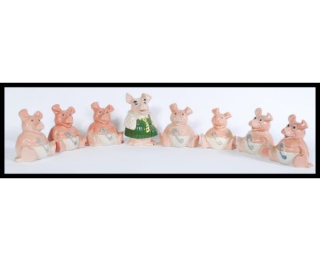 A group of vintage retro Natwest advertising ceramic piggy banks from the Natwest Pigs series.&nbsp;measures: 17 cm high x 10