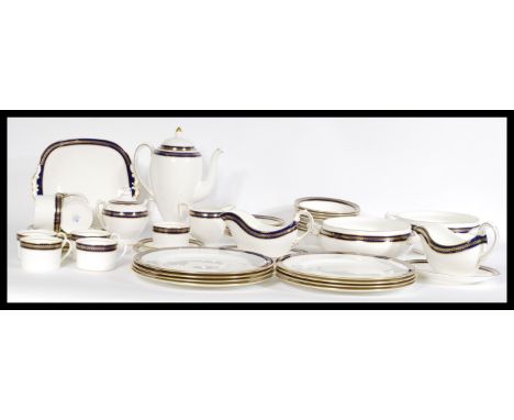A vintage ceramic Coalport service including plates, tea cups and saucers, gravy boats, coffee pot, terrines and sugar bowl h