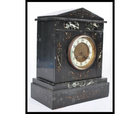 A 19th century Victorian slate marble mantel clock having a white enamel chapter ring with Arabic numerals and faceted hands.