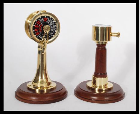 Two vintage style nautical ship instruments - one being an engine room telegraph ships speed dial on turned wooden base with 