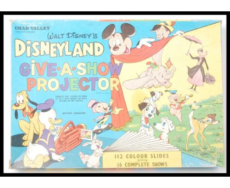 A 1960's vintage Chad Valley made Walt Disney ' Disneyland Give A Show Projector '. Appears to be complete in the original bo