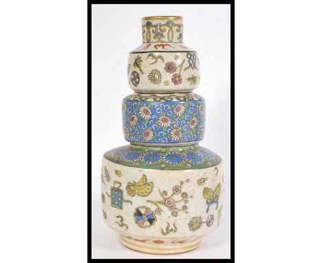 A fabulous Chinese cloisonne three step Gourd vase, decorated with flowers and wildlife in vibrant colours, together with ano