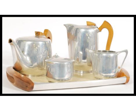 A vintage retro mid 20th century Picquot Ware coffee/ tea service made from stainless steel and beech wood including a teapot