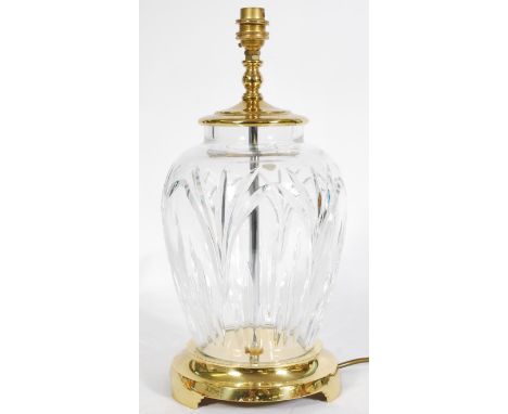 A Waterford crystal table lamp raised on a brass pedestal base and a knopped light stem.&nbsp;Measures: 48 cm high x 23 cm di