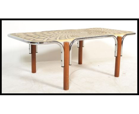 A vintage retro 20th century chrome tubular tile top large coffee table having a geometric sunburst design. Measures 39 cm x 