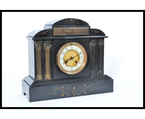 A 19th century Victorian slate marble mantel clock having a white enamel chapter ring with Arabic numerals and faceted hands.