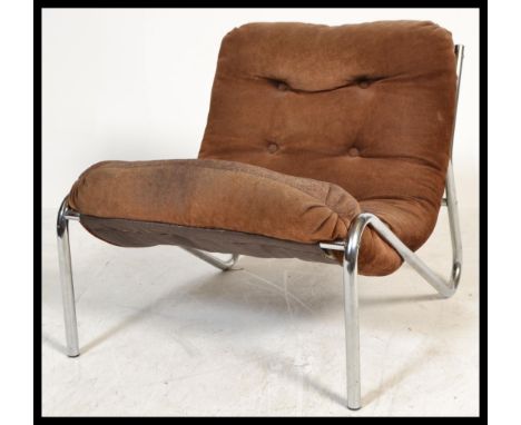 A retro 20th Century Habitat chrome and suede cantilever easy chair, the over stuffed button back cushion upholstered with br