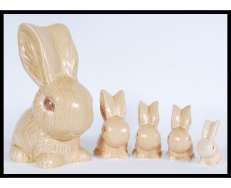 A collection of vintage 20th century ceramic SylvaC graduating brown bunny rabbit figurines to include numbers 1028, 990.&nbs
