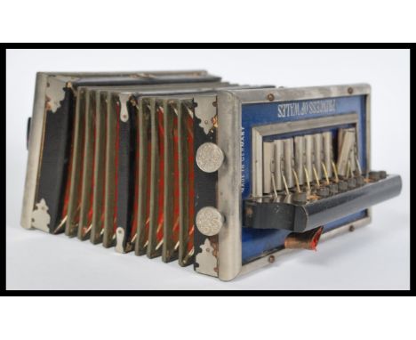 A vintage 20th century Princess of Wales button accordion squeezebox with royalty print bellows with exterior button keys , m