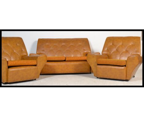 A vintage retro 20th century 1960's three piece suite of angular form consisting of two armchairs and a double sofa settee. F