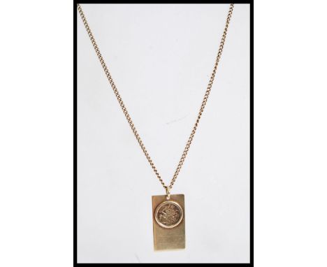 A 9ct British gold pendant necklace with a round spring clasp and inset faux coin dated 1998. The chain length is 20 inches a