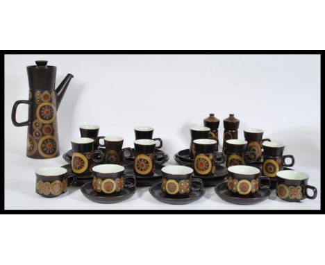 A vintage retro 20th century 1960's Denby coffee service consisting of a tall teapot, salt and pepper pot, tea cups, coffee c
