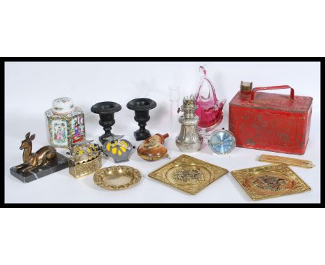 A collectors lot to include a vintage petrol can, a selection of brass wares including a pair of wall plaques, a small emboss