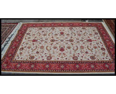 A large&nbsp; vintage Persian floor carpet Keshan rug having a Beige ground with geometric borders and medallions. Measures 2