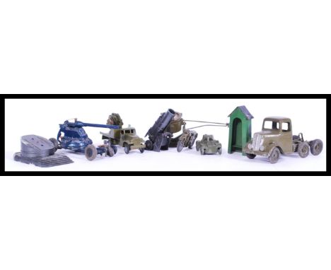 A collection of vintage die-cast model war/ army trucks and toys including a model motor bike, tank, gunner truck with swivel