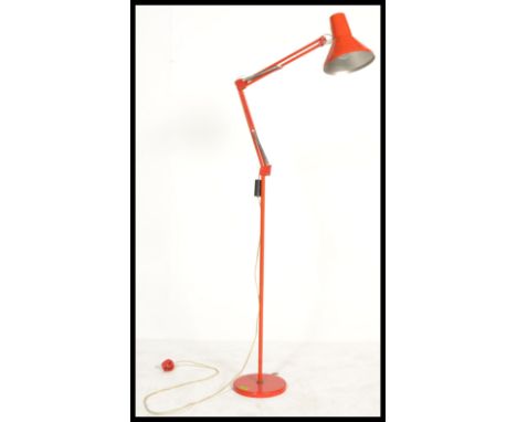 A mid century retro industrial anglepoise floor standing desk lamp marked HCF Denmark. The terraced base in red with pendant 