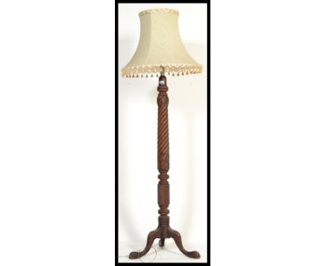 A good, large 19th century mahogany barley twist standard lamp being raised on a splayed legs base with barley twist column a