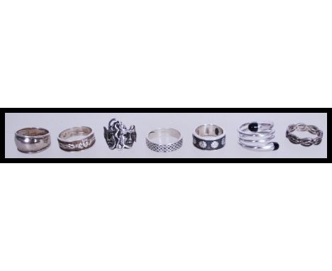 A collection of seven silver rings to include a 925 silver claddagh ring, a celtic knot decorated band, a silver band ring de