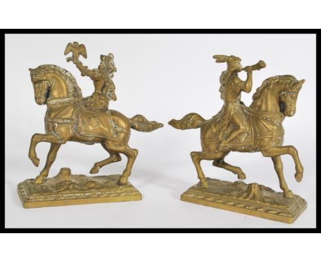 A pair of 19th Century cast brass sculptures / figurines modeled as hunters, one of a Falconer and the other with hunting hor