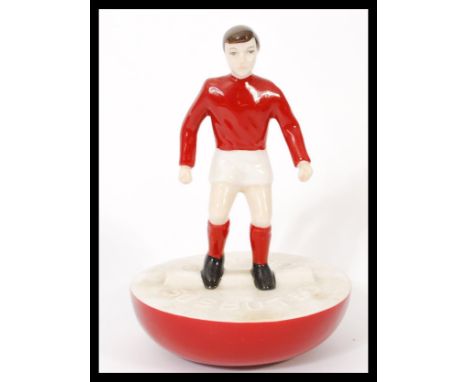 A Royal Doulton Subbuteo ceramic football figurine MCL 12 featuring a player in red and white kit on red and white base. Limi