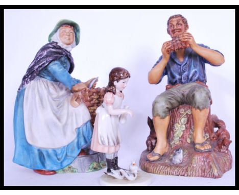 Two Royal Doulton collectable ceramic figurines to include Dream Weaver HN2283 and Old Meg HN2494.&nbsp;Measures: 23 cm high.