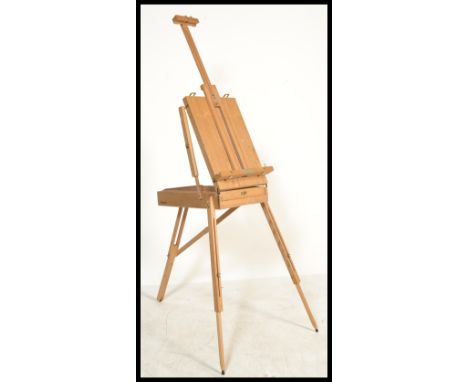 A 20th century artists collapsible easel box with three extendable legs and adjustable easel including a drawer compartment w