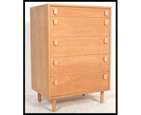 A retro 20th Century light teak wood pedestal chest of drawers, five graduating drawers raised on turned stub supports. Measu