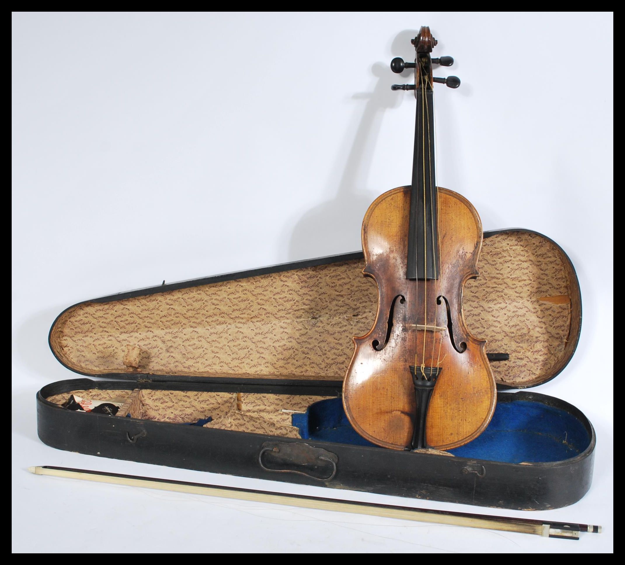 A 19th century Victorian walnut violin with a horse hair bow with