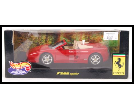 A Hot Wheels precision diecast model 1:18 scale ' Ferrari F355 Spider ' 25733 boxed diecast model. Contents mint and unused, 