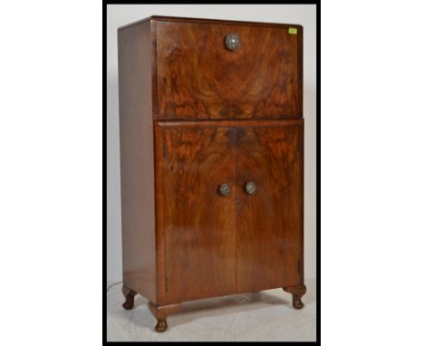 A vintage 20th Century&nbsp;1930's Art Deco walnut cocktail cabinet / bar with appointed interior to the metamorphic top havi