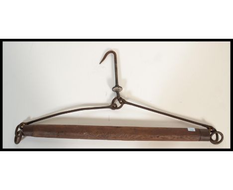A late 19th Century Victorian wooden and cast iron horse cart / carriage linkage together with hanging hook, ideal for lighti